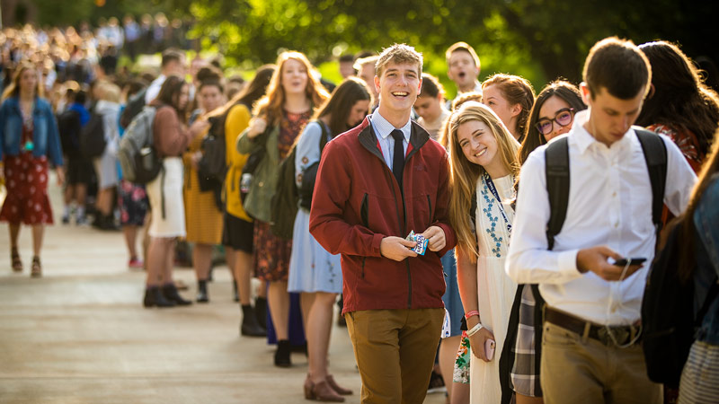 Long line of BYU students, smiling