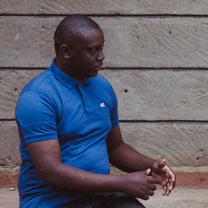 African man with his head turned to the side.
