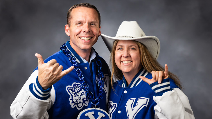Brandon and Heather Smith smiling in BYU clothing